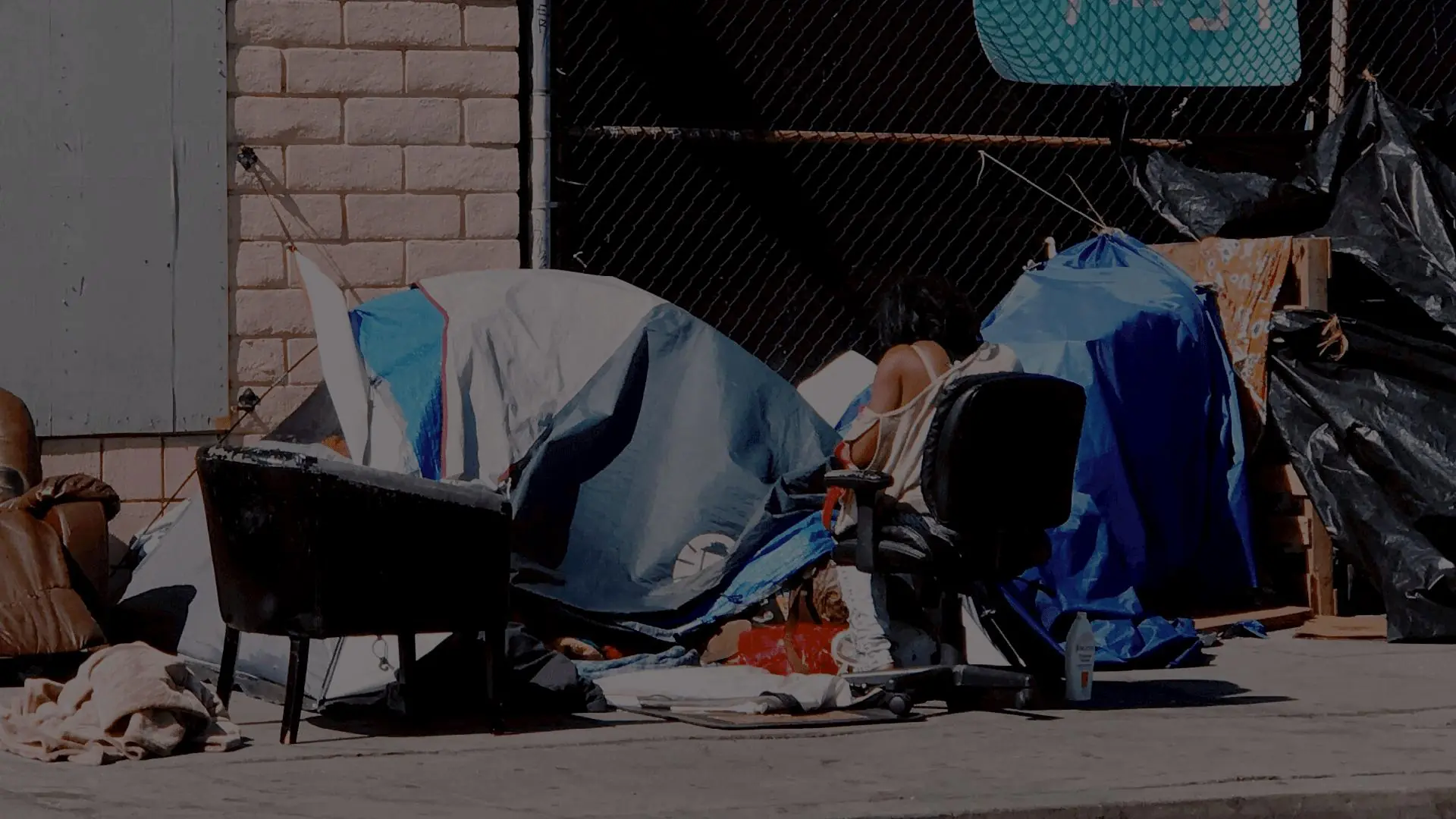 Tents set up along a city sidewalk